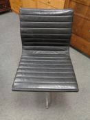 A Vitra Charles Eames designed Alu swivel chair upholstered in black leather with chrome frame