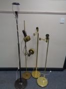 Four brass rise and fall standard lamps (continental wiring)