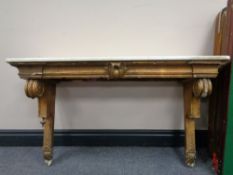 A gilt and gesso white marble topped shelf