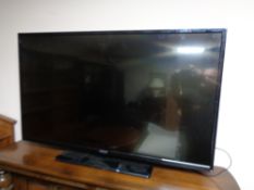 A Hitachi 42 inch LCD TV with remote