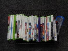 A basket of X Box 360 and playstation games - Fifa,