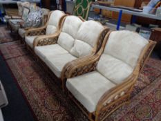 A four piece bamboo and wicker conservatory suite