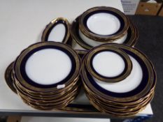 Thirty pieces of Russian Kuznetsov blue and white gilded porcelain dinner ware