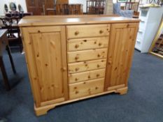 A ducal pine double door bedroom chest fitted with six central doors