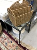 A metal glass topped lamp table together with a wicker magazine rack and light shade