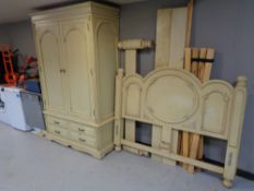 A contemporary cream double door wardrobe fitted with four drawers together with 5' bed frame.