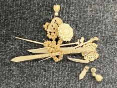 A group of bone and ivory pieces to include jewellery,