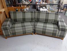 A shaped settee in tartan print