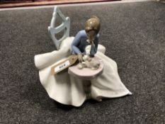 A Nao figure - Seated lady with cat