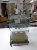 A square counter topped jewellery display cabinet fitted with internal shelves together with a ring