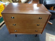 A twentieth century teak beautility three drawer chest