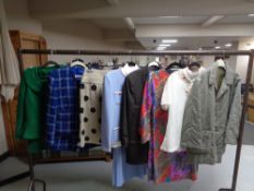 A rail of lady's designer clothing, jacket and skirt, Hobbs of London two piece set,