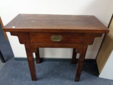 A Chinese style console table fitted with a drawer