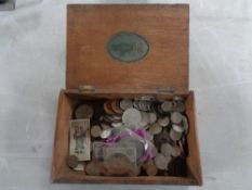 A wooden cigar box containing pre decimal coins and crowns
