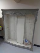 A set of contemporary French style serpentine fronted chabby chic bookshelves