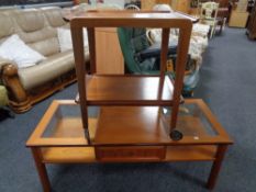 A mid century teak two tier trolley together with coffee table