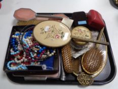 A tray of petitpoint dressing table set together with one other set,