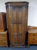 An Edwardian oak hall wardrobe