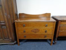 An Edwardian oak three drawer dressing chest (no mirror)
