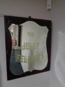 An Edwardian mahogany framed shield mirror 'The Jolly Fellows'