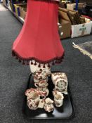 A tray of seven pieces of Red Mandalay mason's china, four graduated jugs, mantle clock,