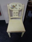 A cream and gilt Chinese style dining chair with bird and flower decoration