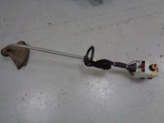 A Ryobi petrol strimmer