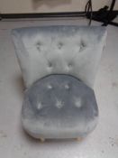 A contemporary buttoned dralon bedroom chair on pine legs