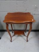 A shaped Edwardian mahogany table