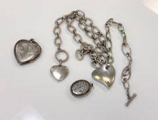 Two silver chains strung with hearts, together with two engraved silver lockets.