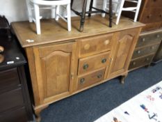 An early 20th century French oak sideboard, a/f CONDITION REPORT: Missing one handle.