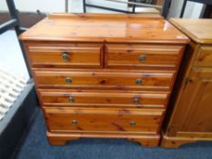 A pine five drawer chest