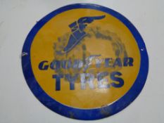 A reproduction circular Goodyear tyres sign