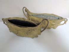 A pair of Art Nouveau metal planters with liners