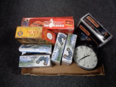A box of challenge drill, board game, four sets of Out there binoculars,