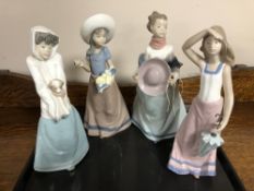 A tray of four Nao Four Seasons figures (a/f) CONDITION REPORT: One restored.