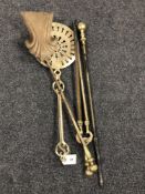 Three Victorian brass fire companion pieces together with a brass chestnut roaster