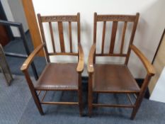 A pair of Edwardian oak carver armchairs