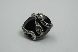 A large 18ct white gold (tested) agate and diamond snake ring, size K/L.