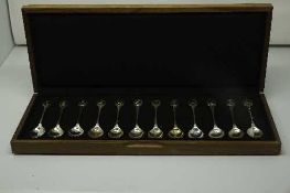 A set of twelve silver teaspoons issued by John Pinches for the Royal Society for the Protection of