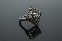 A white gold Art Deco style emerald and diamond ring,