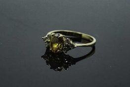 An 18ct yellow gold citrine and diamond ring, size O.