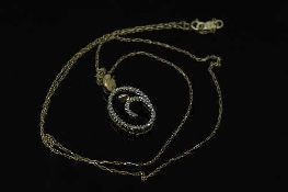 A 10ct gold 'Mother and Child' diamond set pendant on yellow gold chain.