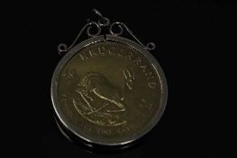 A South Africa gold 1 oz Krugerrand 1974 with mount