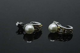 A pair of 14ct white gold pearl and diamond earrings, 4.5g, approximately 0.12ct diamond weight.