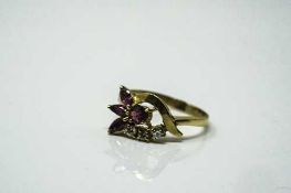 An 18ct gold ruby and diamond ring, size P/Q.
