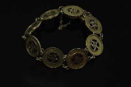 A 14ct gold Chinese panel bracelet, 14.8g.