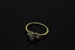A 14ct yellow gold marquise and round cut diamond ring, the central stone approximately 0.