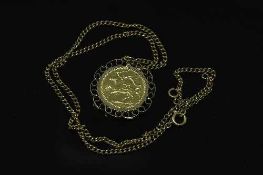 A gold full sovereign - Isle of Man 1973, with pendant mount suspended upon a yellow metal chain.