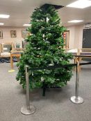 A good quality 8 foot Christmas Tree with adjustable branches and pine cones.